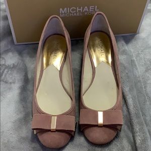 Dusty rose and the material is suede